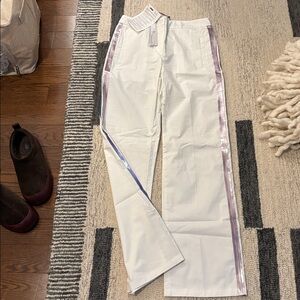 Stylish Y2K-inspired white pants accented with pink purple reflecting stripes